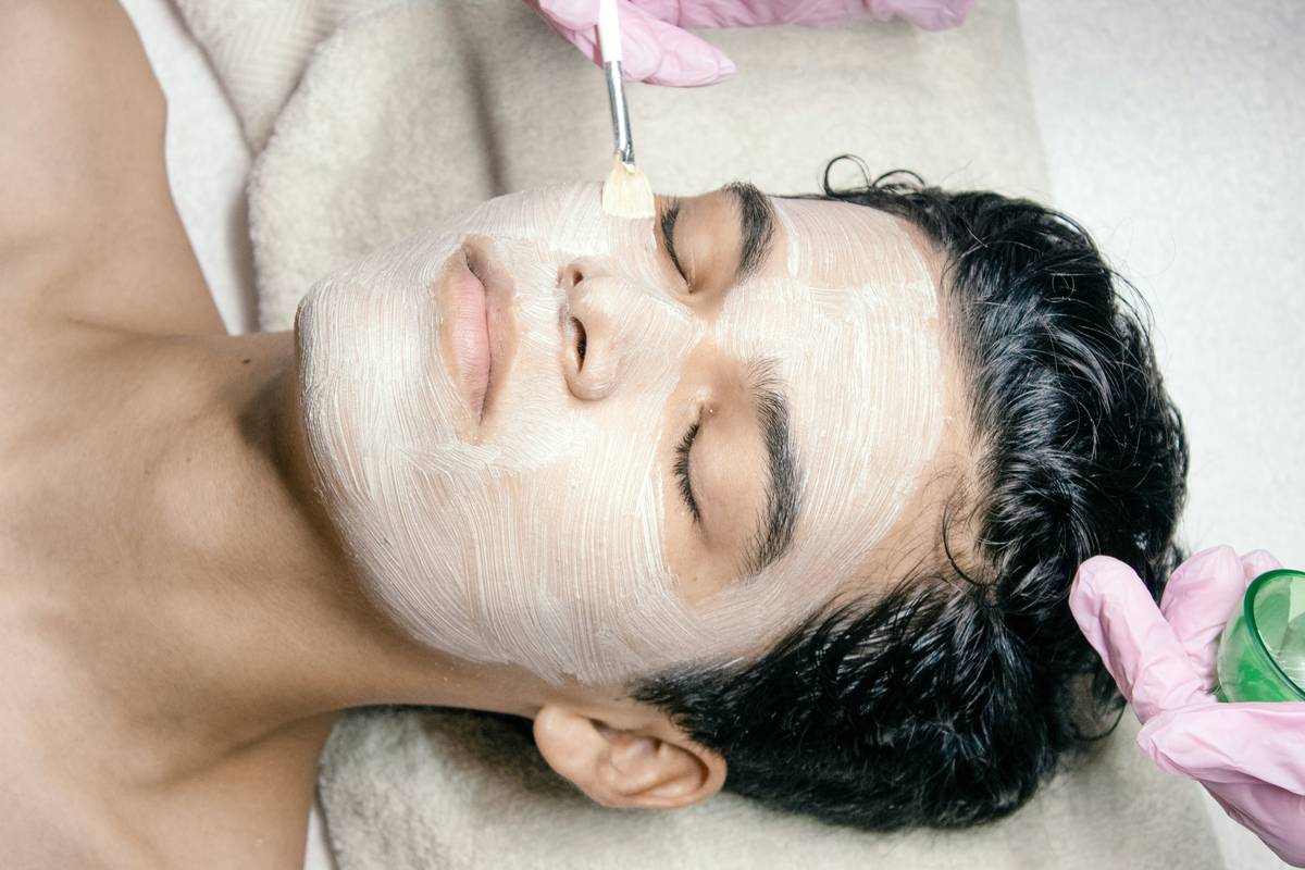 Man with sensitive skin applying fair and lovely men face wash gently with fingertips