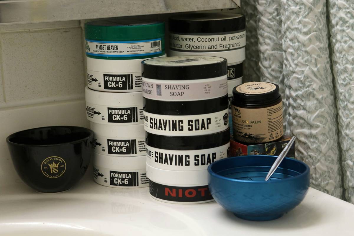 Comparison of different simple face wash for men bottles on a bathroom counter